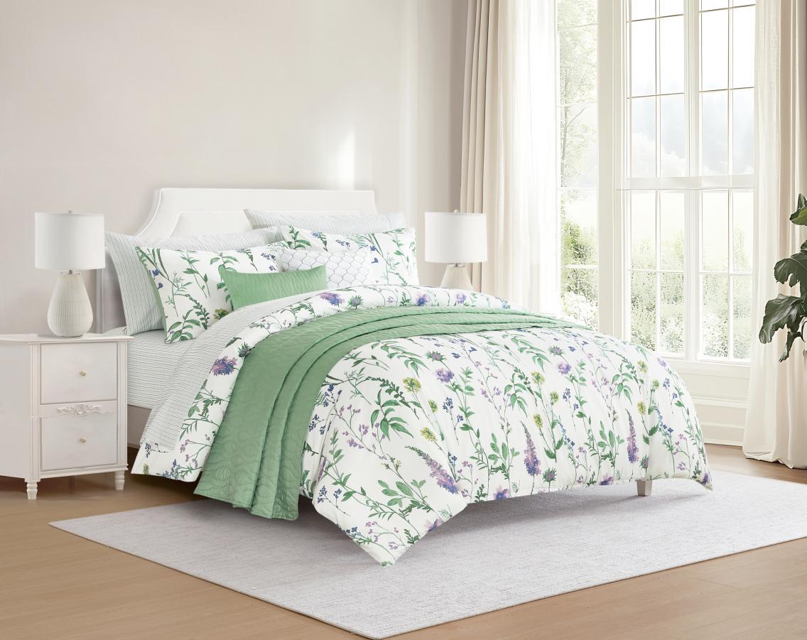 Green floral bedding in a styled room set