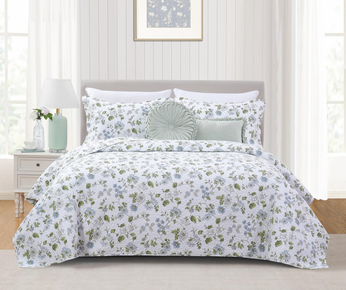Blue and green floral bedding collection photographed for retail presentation